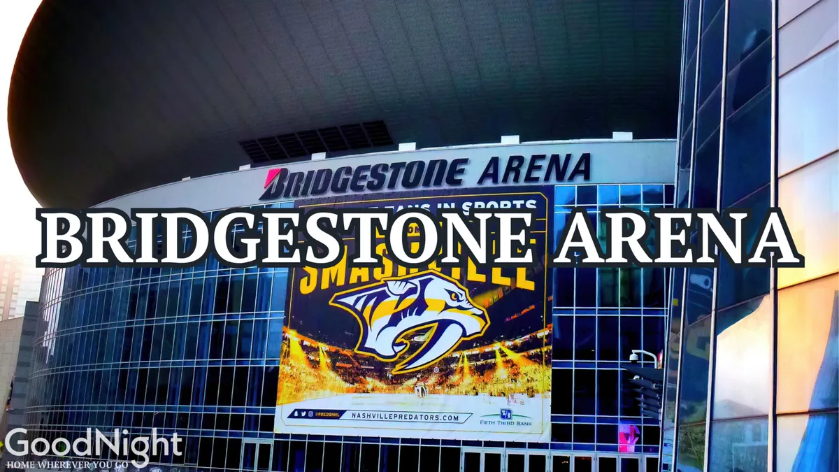 An exterior view of Bridgestone Arena, complete with the bold signage and energetic banners, illustrating its status as a key destination for major events, sports, and concerts in downtown Nashville.