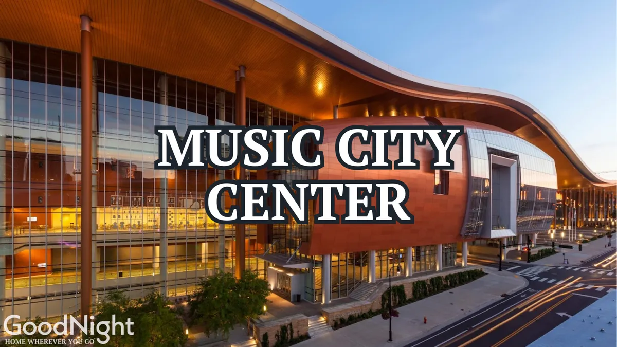 This image features the striking architecture of the Music City Center as seen from the exterior, with its distinctive curved roof, expansive glass windows, and surrounding greenery. The energetic atmosphere hints at lively events and professional gatherings taking place inside.
